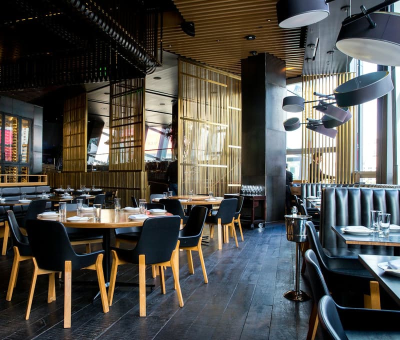 A full restaurant dining room during evening service